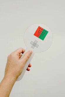 Person choosing eyeglass frames at an optician